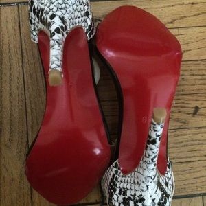 Red bottom snake high heels